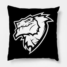 a black and white pillow with a wolf head on it