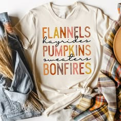 "Flannels Hayrides Sweaters Pumpkins Bonfires Womens Fall Shirt, Halloween Shirt, Pumpkin Shirt, Pumpkin Patch Shirt, Thanksgiving Shirt *Made to Order* All of our shirts are made to order with the sizes, colors and image specifications selected at the time your order is placed, and printed right here in the Dallas, Texas area, USA! Unless otherwise specified, our graphic tees are printed (not vinyl). We use a state of the art Direct to Garment printer which uses Eco-friendly water-based inks, s Sweater Pumpkins, Patches Shirt, Pumpkin Shirt, Baby T Shirts, Thanksgiving Shirts, Black Queen