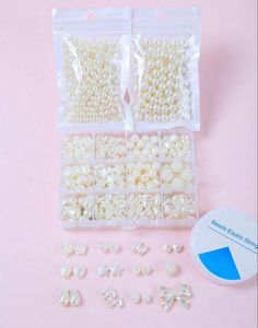 two bags of pearls are shown next to each other on a pink surface with a blue and white sticker