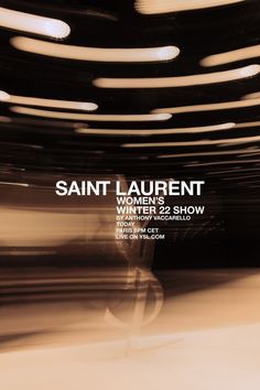 an advertisement for saint laurent women's show in white and black with circles on the ceiling