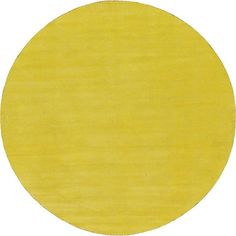 a yellow circle rug on a white background