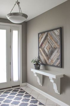 a potted plant sitting on top of a white shelf next to a door way