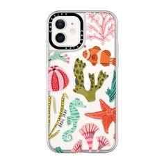 an iphone case with sea animals and corals on the front, in clear plastic