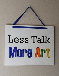 a sign that says less talk more art