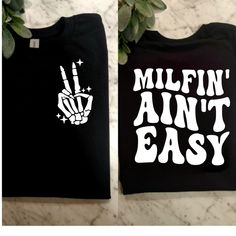 two t - shirts that say millin'an't easy and one with a hand holding the peace sign