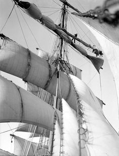 a black and white photo of an old sailing ship