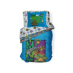 the teenage mutant bedding set is blue and has an image of tm turtles on it