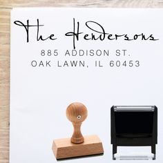 a rubber stamp with the words the hendersons on it and an image of a chair