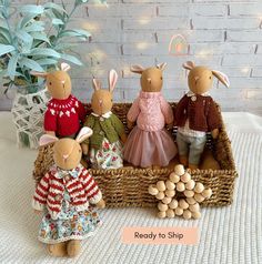 a group of stuffed animals sitting in a basket