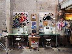 a room with two desks and various items on the wall