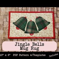 a quilted wall hanging with two bells on it and the words, jungle bells mug rug