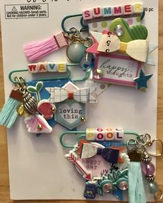 a bunch of key chains that are on a piece of paper