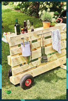 a wooden cart with gardening utensils on it