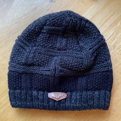 Great And Warm Never Used Hat Warm Gray Hats For Outdoor, Warm Gray Hat For Outdoor, Gray Casual Beanie One Size, Classic Black Hats For Cold Weather, Warm Black Hat One Size, Warm Black Cap Hat, Warm Black Cap, Casual Adjustable Gray Beanie, Black Warm Beanie One Size