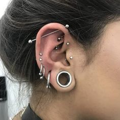 a woman with ear piercings on her ears