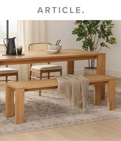 a wooden table with two benches next to it and a potted plant on top