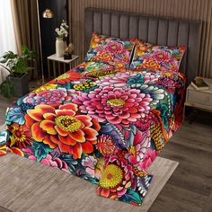 a bed with colorful flowers on it in a room