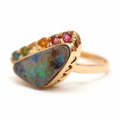 "A mini version of the rainbow opal peacock ring! Super colorful 6.1ct Austrailian boulder opal set in 14k yellow gold with a rainbow of tourmalines. Ring face measures 1/2\" x 7/8\". Ring size 6. Weighs 5.75 grams. Sizing available Layaway available" Multicolor Opal Multi-stone Rings, Fine Jewelry Multicolor Multi-stone Opal Ring, Multicolor Opal Ring, Gold Opal Ring, Peacock Ring, Boulder Opal Ring, Watch Cufflinks, Rainbow Opal, Opal Ring Gold