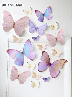 pink and purple butterflies are hanging on the wall in front of a white door with text overlay that says pink version