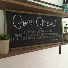 a sign that says go be great on a shelf with succulents and potted plants