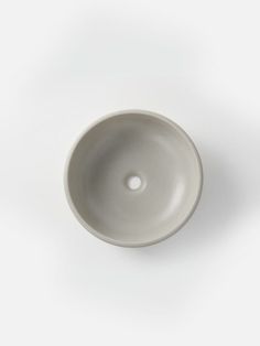 a white bowl sitting on top of a table