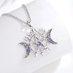 Connect with divine energy and bring your magic to life with this stunning Triple Moon Pentagram Necklace. Crafted with hypoallergenic sterling silver that's free of nickel, lead, and cadmium, this Wicca Pagan Jewelry is made to last—letting you enjoy its beauty for years! Have confidence in its high-quality and show up to the world, looking simply magical ☪️ Pendant Size: 35.6*26.6mm；Weight:6.5g; Chain size: 18 inch ( 46cm) ,Chain width 1.1 mm Package: Package Included (To Choose one of 3 Diffe Witchy Beauty, Triple Moon Pentagram, Triple Goddess Necklace, Magical Pendant, Moon Pentagram, Spooky Jewelry, Pentacle Necklace, Witchy Necklace, Moon Pentacle