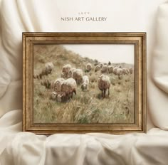 a painting of sheep grazing in a field with the words irish art gallery above it