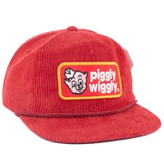 the piggy wiggly hat is red and has an embroidered patch on the front