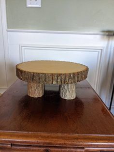 a wooden table that has some kind of tree stump on it