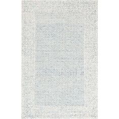 a blue and white rug with an intricate design on the bottom, in front of a white background