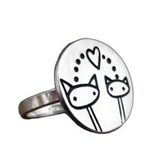 Sterling Silver Cat Family RingSterling silver Sister Cats ring is made to order in your size. Handmade in my Oakland California studio, this charm ring is about 3/4 of an inch across the width.Silver charms are soldered to a 1/8" wide sterling silver band in whole sizes 5-9.Your ring will be made to order, so please give me 1-5 business days to make it. Each item comes in a cute box ready for gift giving, without a receipt. If you'd like to include a gift message, let me know at checkout. Items Sisters Ring, Family Of Cats, Silver Cat Ring, Sister Rings, Dog Heart, Silver Sisters, Dog Ring, Family Rings, Sterling Silver Cat