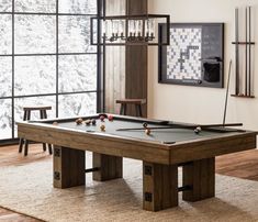 a pool table in the middle of a living room