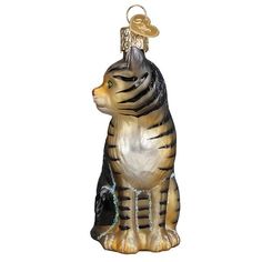 a glass cat ornament with a gold and black stripe on it's face