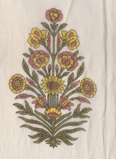 an embroidered piece of cloth with yellow and pink flowers on the front, along with green leaves