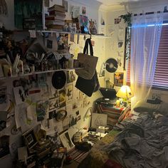 a cluttered bedroom with many items on the wall