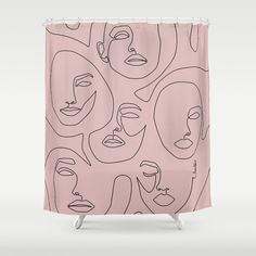 a pink shower curtain with faces drawn on it