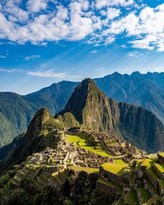 the ruins of machaca picach on top of a mountain in peru, with mountains in the background