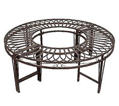 a round metal table with an intricate design