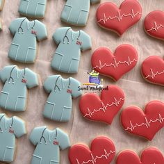 cookies decorated to look like shirts and heartbeats