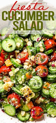 a white bowl filled with cucumber salad on top of a table