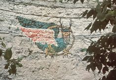 a bird painted on the side of a building