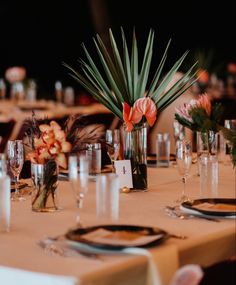 an image of a table setting with flowers and place settings