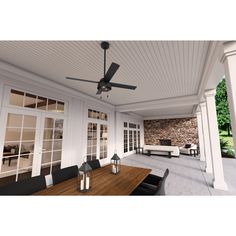 the ceiling fan is hanging from the ceiling in front of an outdoor living room with white walls and wood flooring