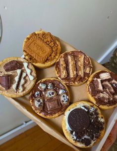 there are many desserts on the tray ready to be eaten