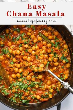 a pan filled with chickpeas and garnished with cilantro sauce