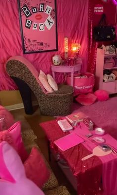 a room with pink furniture and decorations on the walls, including high heeled shoes