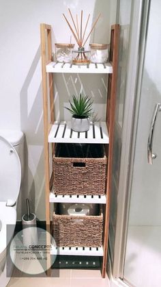 a bathroom with a toilet, shower and shelf filled with baskets next to the toilet