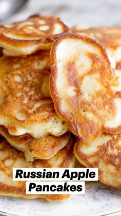 some pancakes are stacked on a plate and ready to be eaten