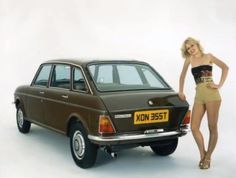 a woman standing next to a brown car on a white background with her hand on the door handle