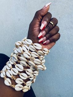 Hey, I found this really awesome Etsy listing at https://www.etsy.com/listing/977419530/forever-jackie-cowrie-bangles Bohemian Gold Beaded Bracelets With Shell, Bohemian Gold Beaded Shell Bracelets, Shell Bangles, Afro Jewelry, Dope Jewelry Accessories, Cowry Shell, Cowrie Shells, Dope Jewelry, African Jewelry